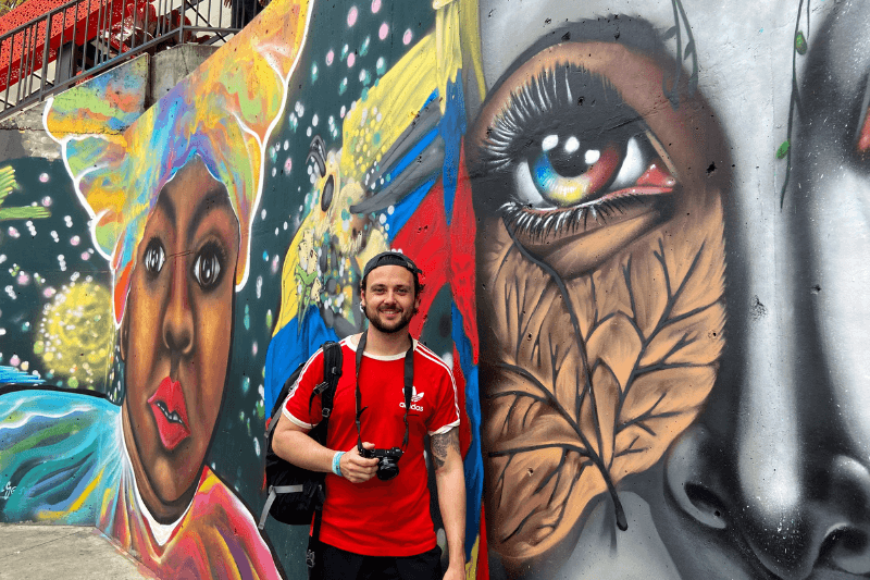 Alex in front of Comuna 13 Street Art