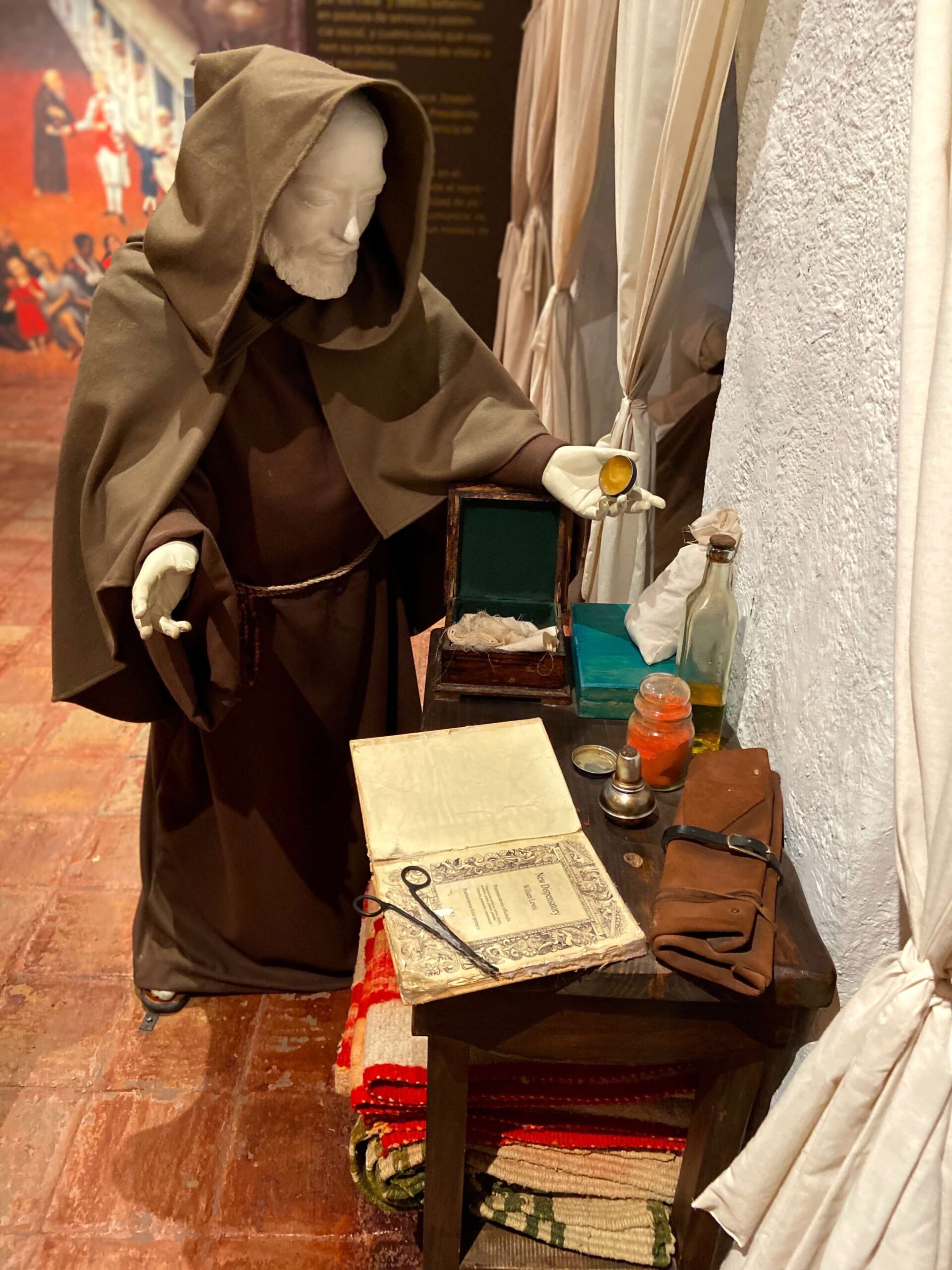 Statue of a Monk performing medicine at Museo de la Ciudad