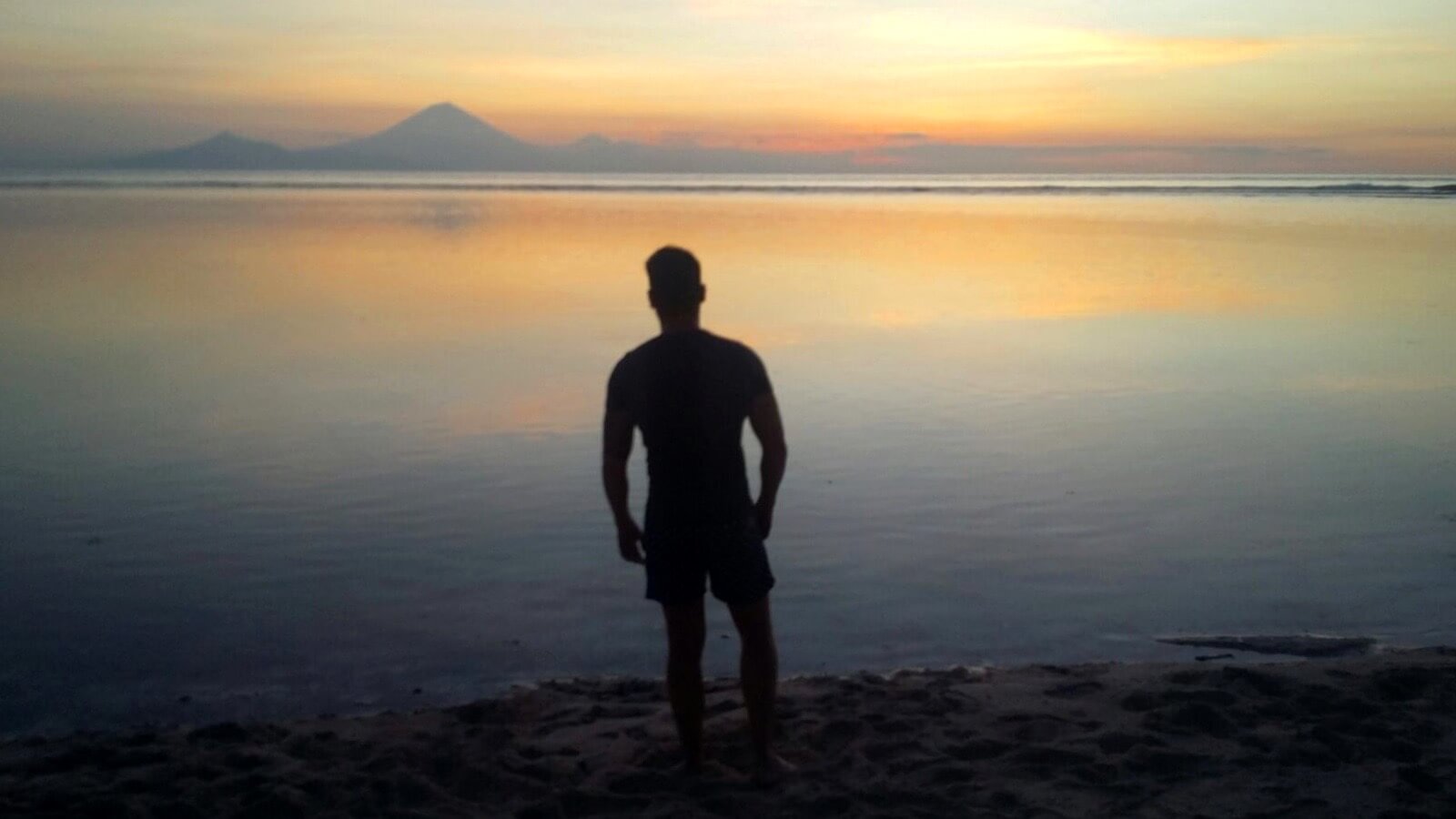 Alex looking out at the sunset over the sea off Gili Trawangan